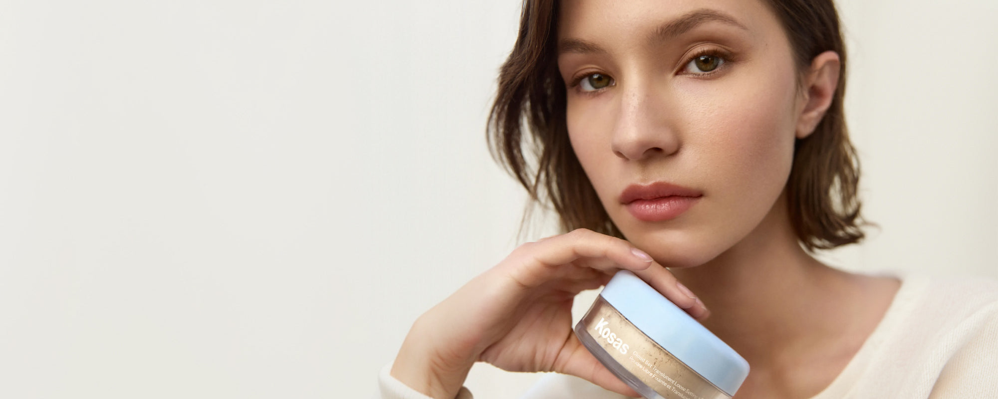Kosas model wearing Cloud Set Loose Powder